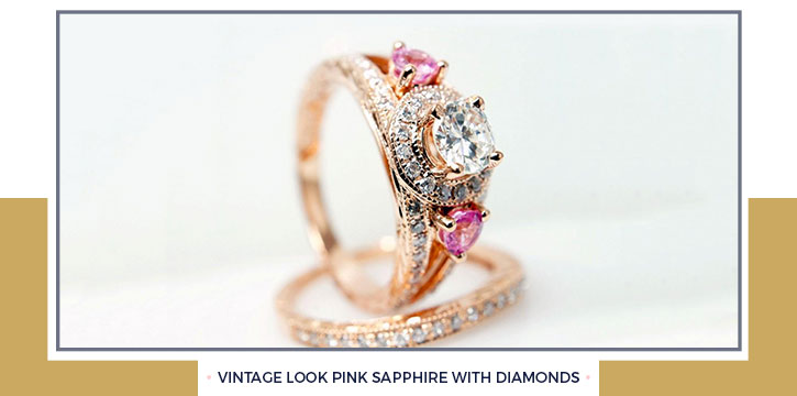 Vintage Look Pink Sapphire with Diamonds This emerald cut pink sapphire ring is a possible choice for anyone who loves vintage looking jewelry. The sapphire is set in 14K white gold and flanked all around by round-cut diamonds.
